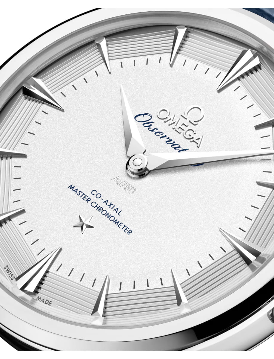 Close view of Constellation Observatory wristwatch with Canopus Gold™ case and dial, and Blue alligator leather strap.