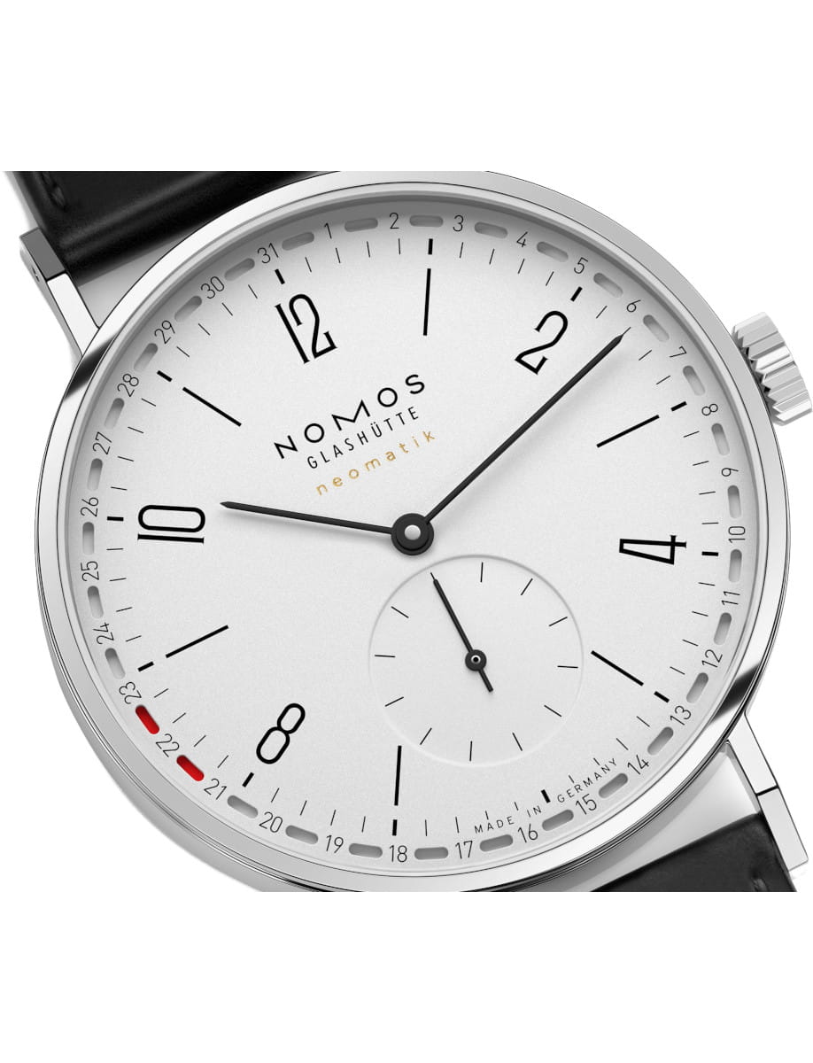 Side view of Nomos Tangente neomatik 38 Update wristwatch with stainless steel case, white dial, and black Horween Genuine Shell Cordovan strap.