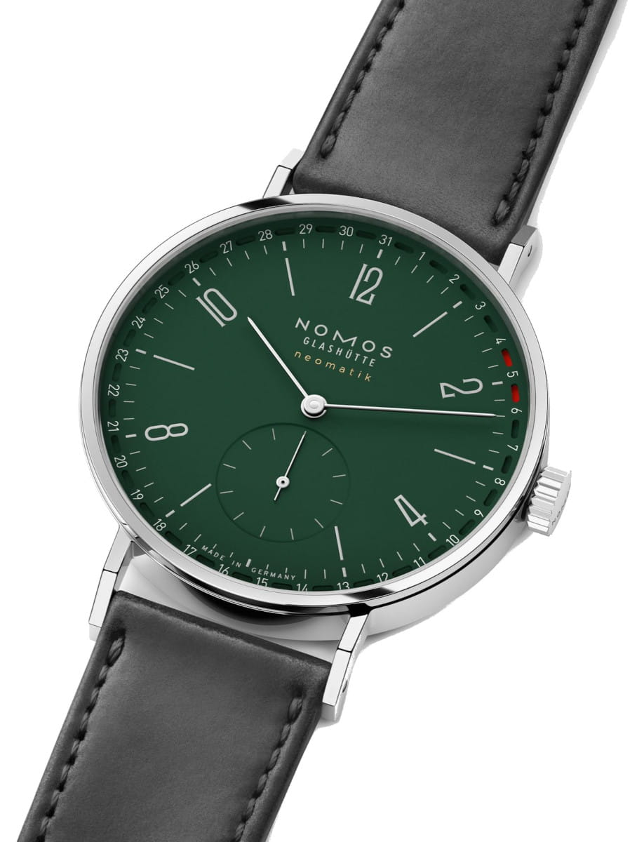 Side view of Nomos Tangente neomatik 38 Update forest green wristwatch with stainless steel case, green dial, and black Horween Genuine Shell Cordovan strap.