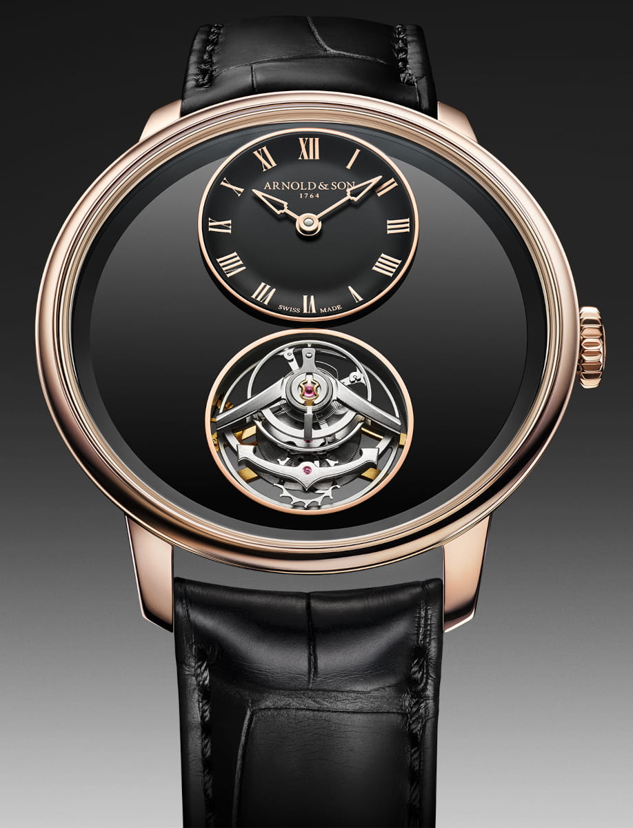 Front view of Arnold&Son wristwatch with 5n red gold case, black dial, and black leather strap.