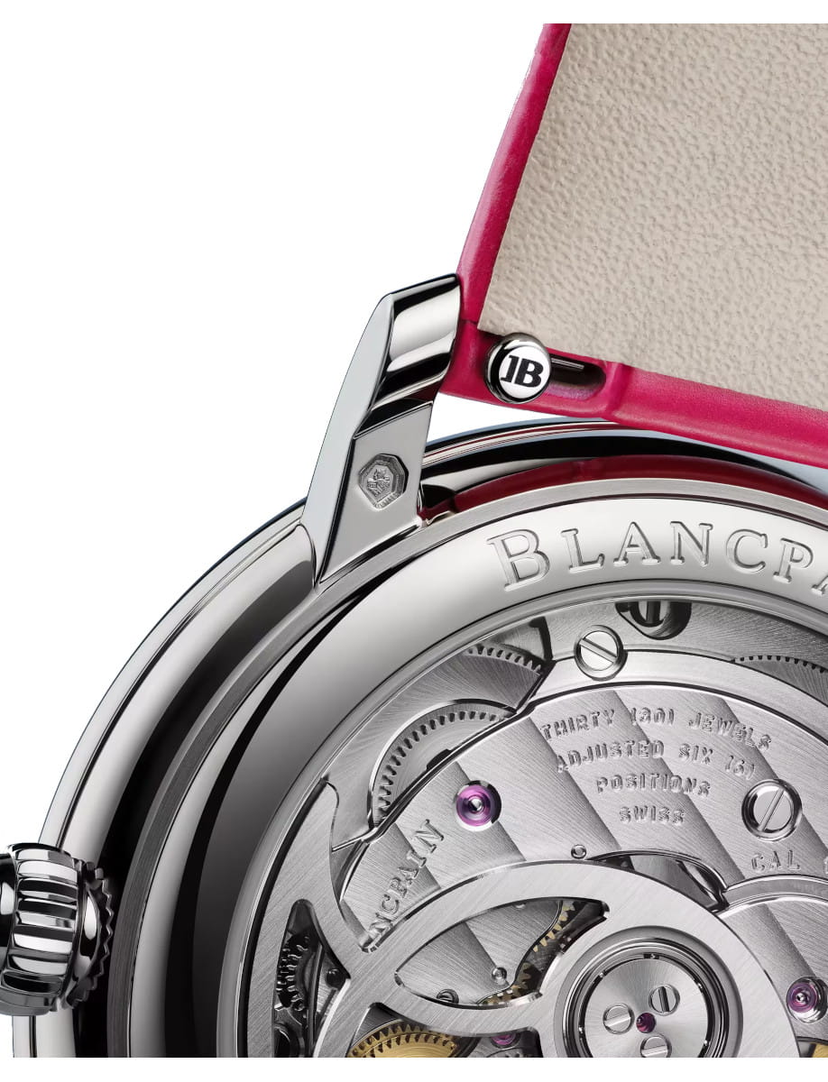 Close view of the back of Blancpain Ladybird Colors wristwatch with white gold case, open case back, and pink leather strap.