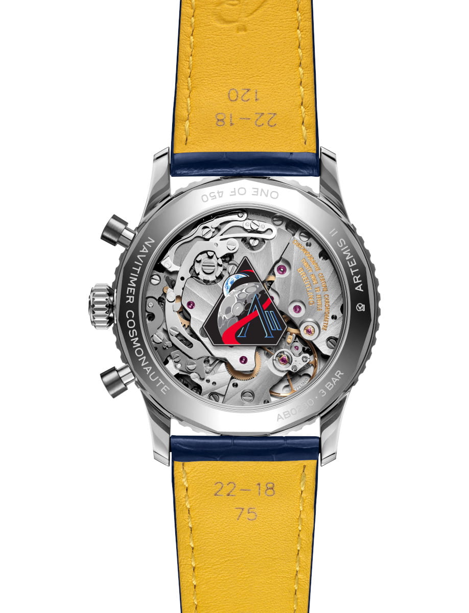 Back view of Breitling Navitimer B02 Chronograph 41 wristwatch with stainless steel case, transparent case back, and blue alligator leather strap.