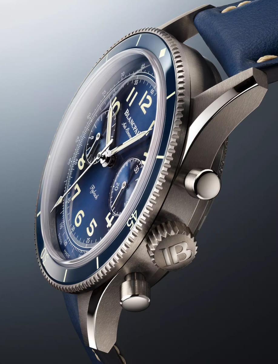 Side view of Blancpain Air Command wristwatch with titanium case, sunburst blue dial, and blue calf leather strap.