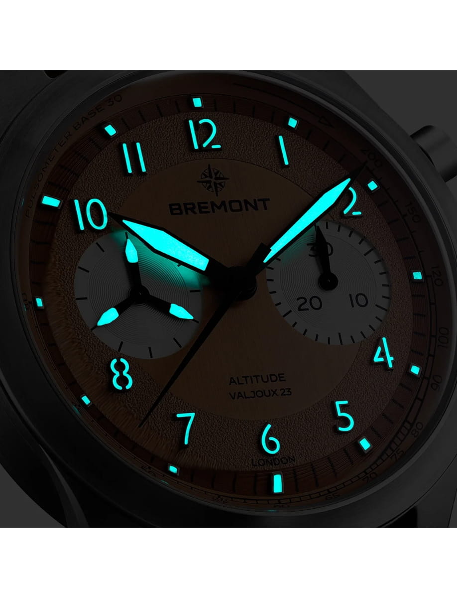 Night view of Bremont wristwatch with titanium case, salmon galvanic dial and brown nubuck leather strap