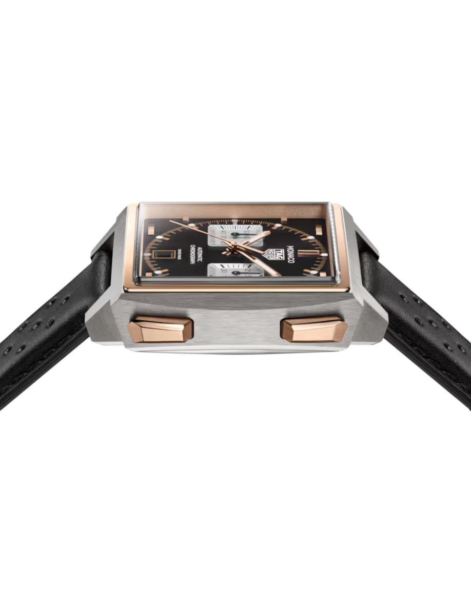 Side view of Tag Heuer Monaco Chronograph wristwatch with 18K 5N rose gold and titanium case, opaline black dial, and black leather strap.