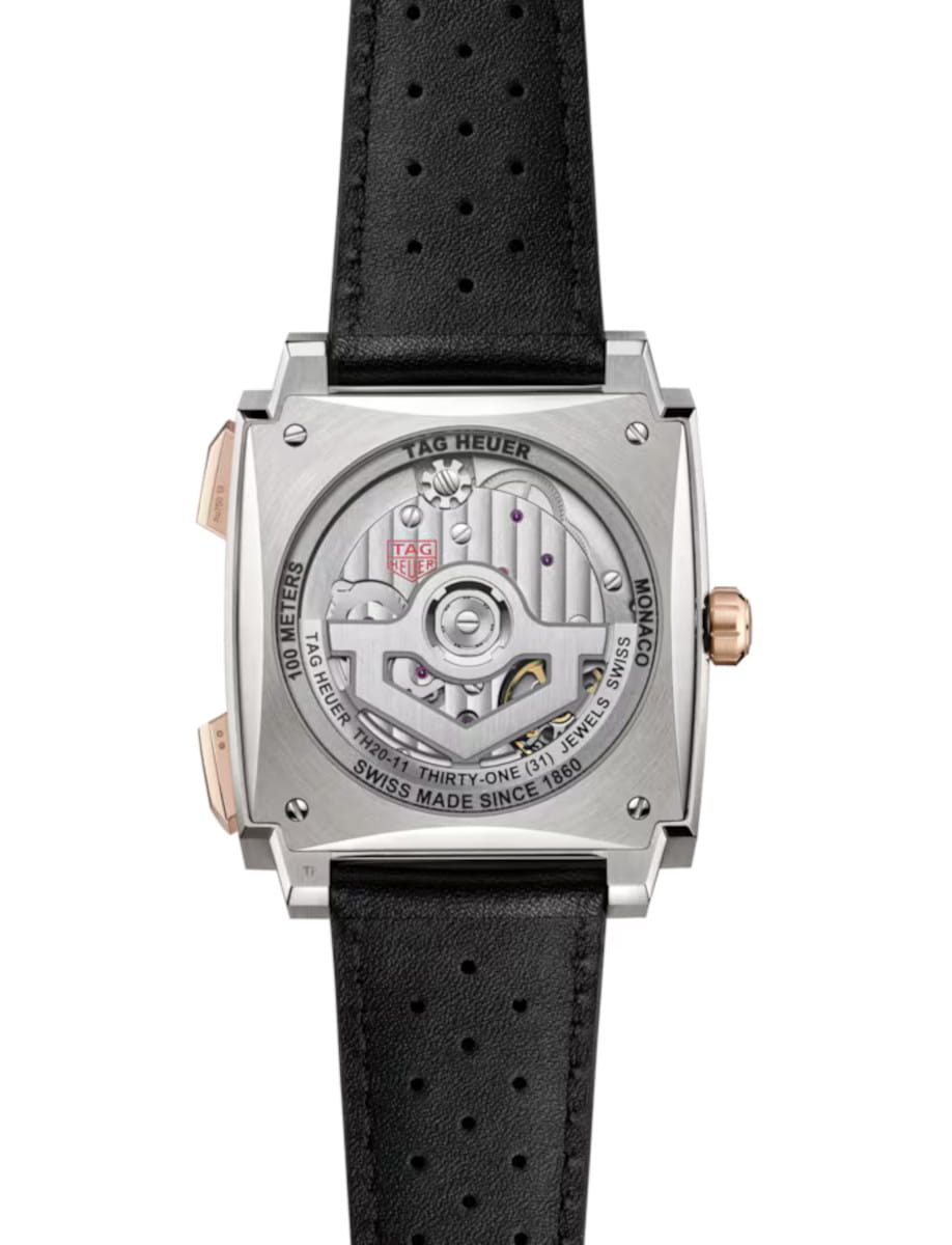 Back view of Tag Heuer Monaco Chronograph wristwatch with 18K 5N rose gold and titanium case, sapphire case back, and black leather strap.