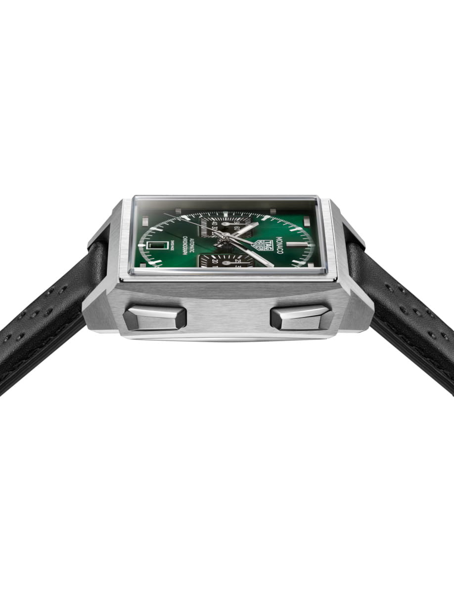 Side view of Tag Heuer Monaco Chronograph wristwatch with titanium case, green dial, and black leather strap.
