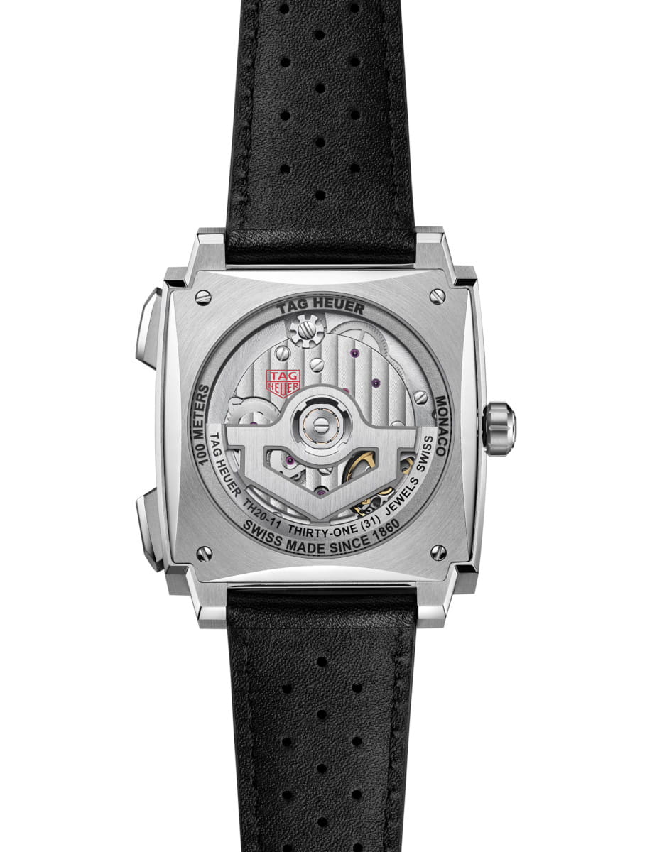 Back view of Tag Heuer Monaco Chronograph wristwatch with titanium case, sapphire caseback, and black leather strap.