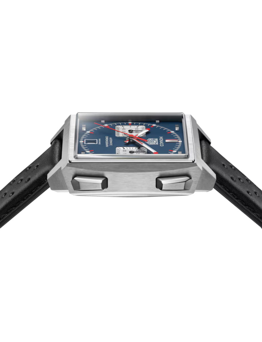 Side view of Tag Heuer Monaco Chronograph wristwatch with titanium case, opaline blue dial, and black leather strap.
