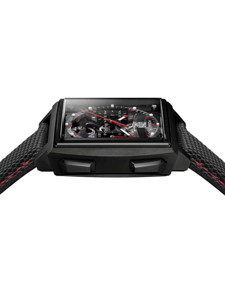 Side view of Tag Heuer Monaco Evergraph wristwatch with Titanium coated with black DLC case, black dial, and black rubber strap.