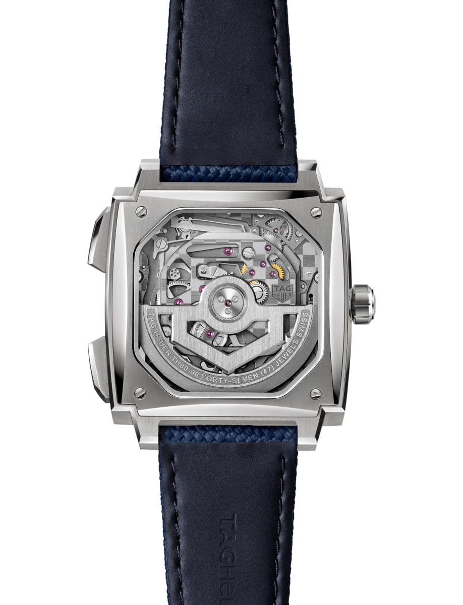 Back view of Tag Heuer Monaco Evergraph wristwatch with titanium case, sapphire caseback, and blue rubber strap.