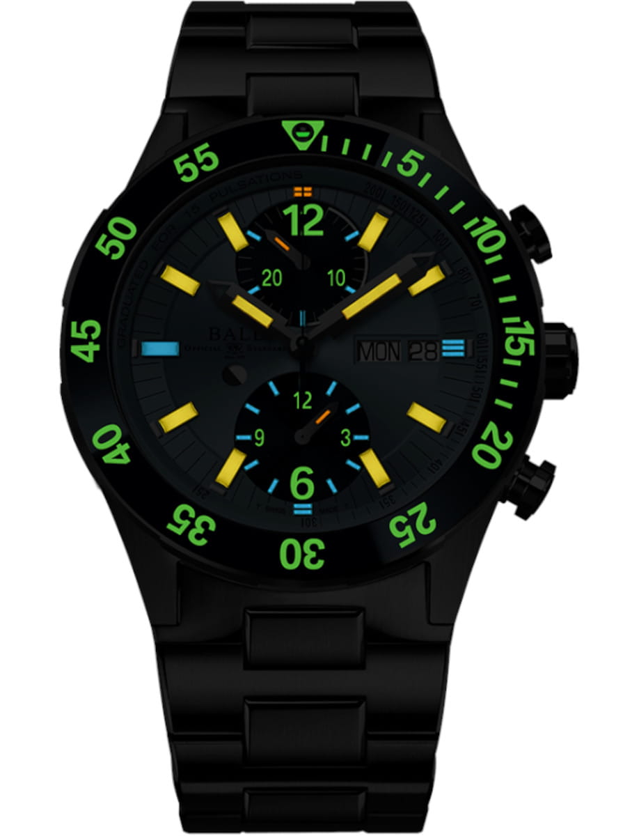 Night view of Ball Roadmaster Rescue Chronograph (42mm) wristwatch with stainless titanium case, titanium and stainless steel bracelet, and ice blue dial.