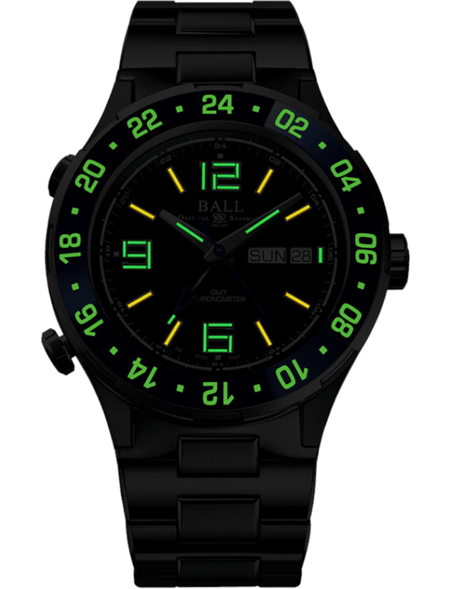 Night view of Luminox Roadmaster Marine GMT wristwatch with titanium case and bracelet, and black dial.