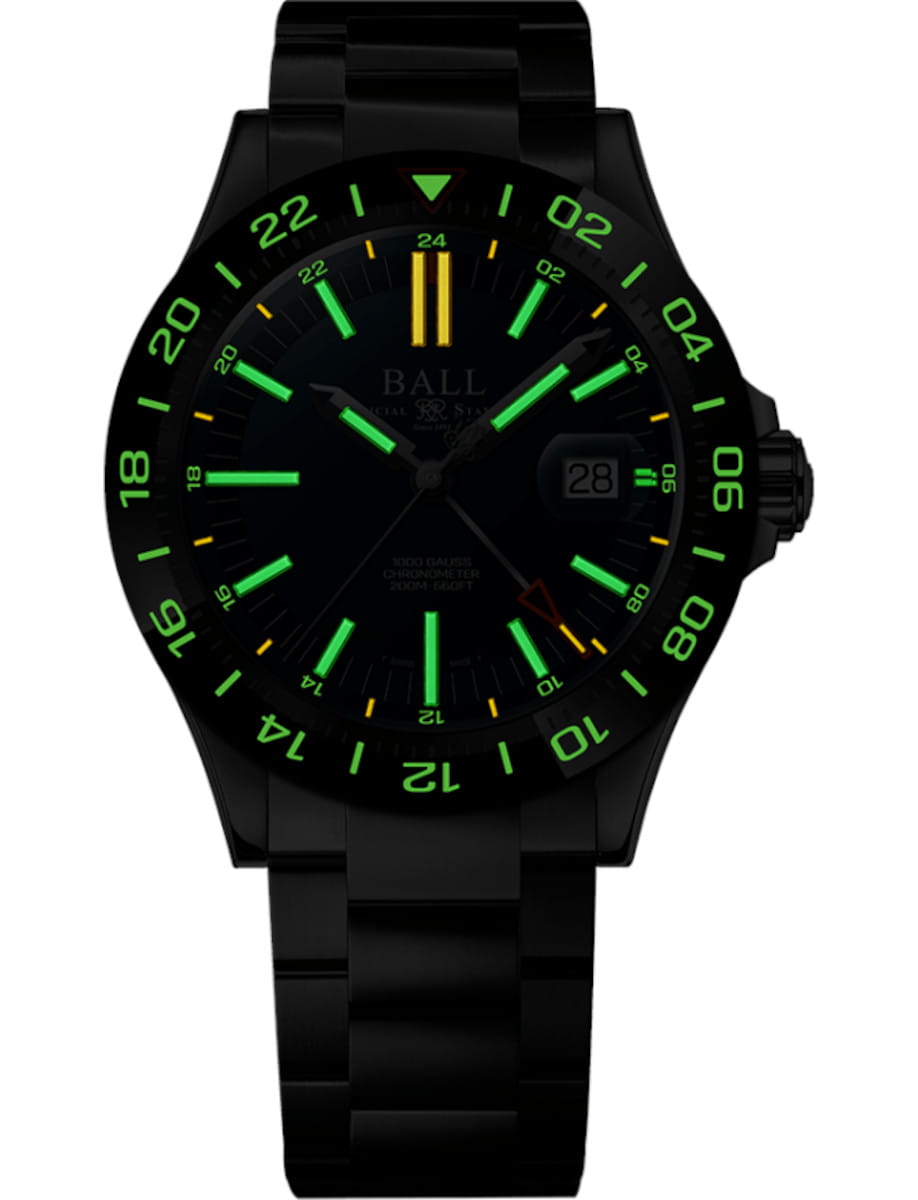 Night view of Ball Engineer III Outlier (40mm) wristwatch with stainless steel case and bracelet, and blue dial.