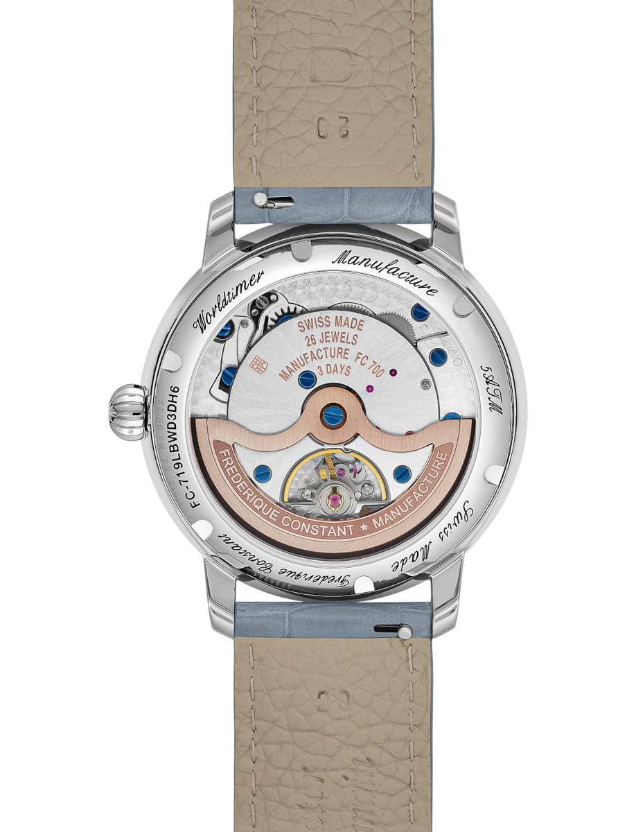 Back view of Frederique Constant Manufacture Classic Worldtimer wristwatch with stainless steel case, open caseback, and blue alligator leather strap.