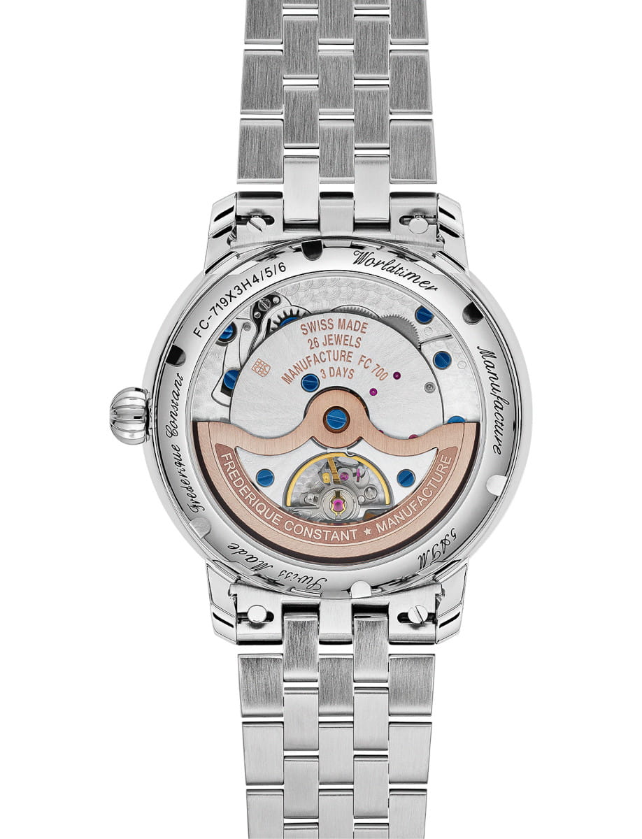 Side view of Frederique Constant Manufacture Classic Worldtimer wristwatch with stainless steel case and bracelet, and open case back.