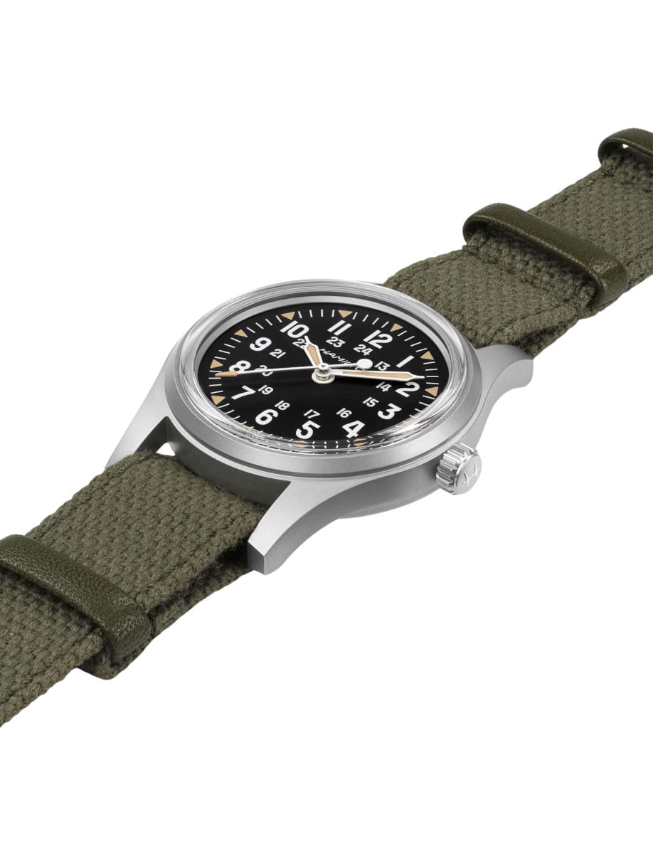 Side view of Hamilton Khaki Field wristwatch with stainless steel case, black dial, and textile strap.