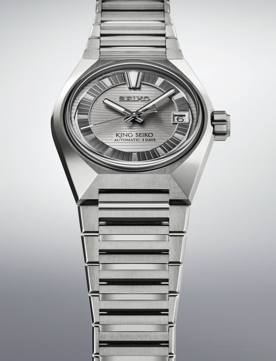 Side view of Seiko wristwatch with titanium case and bracelet, and grey dial.