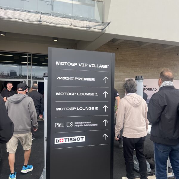 Signage outside of paddock showing where to go to lounges