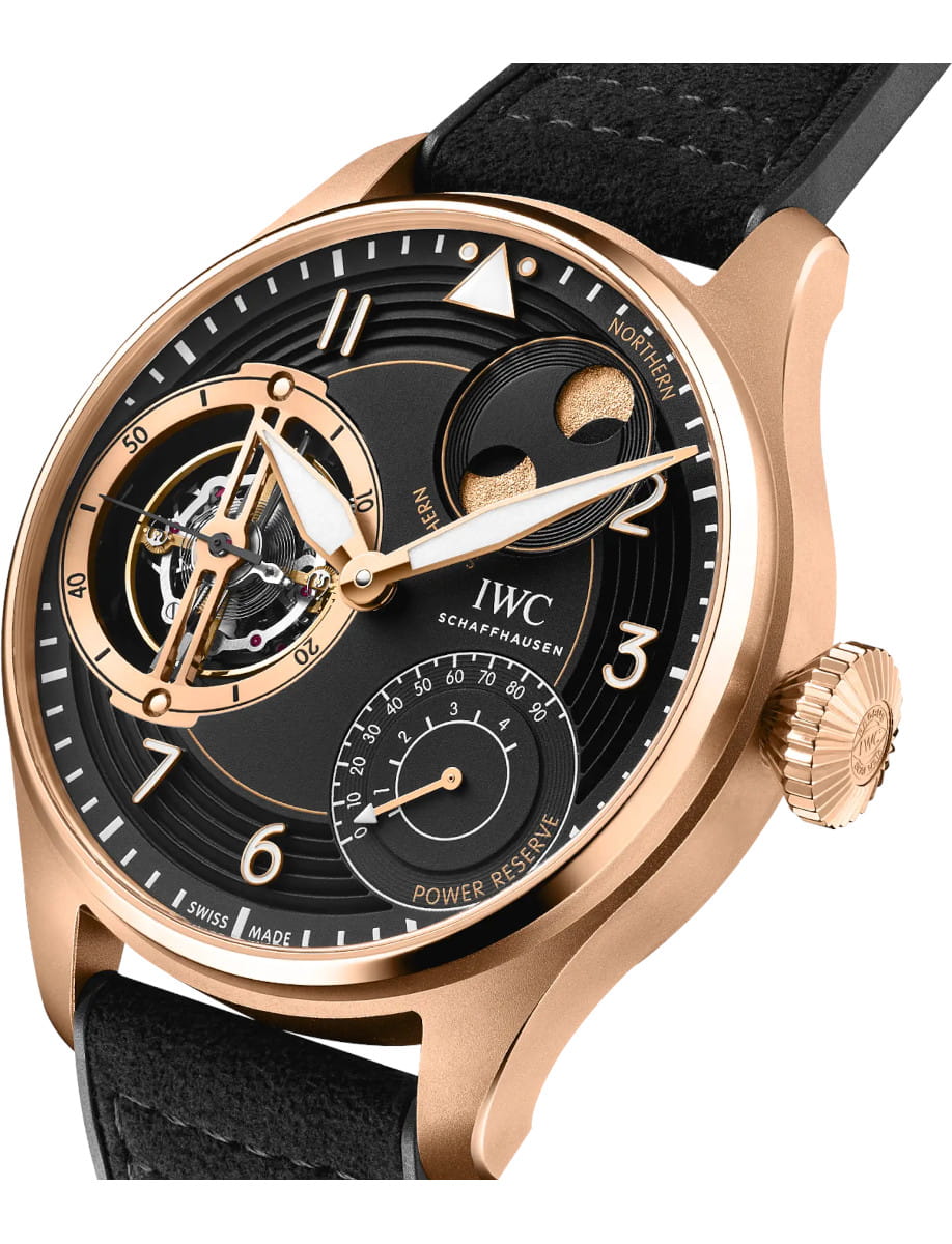Side view of IWC Big Pilot’s Watch Constant Force Tourbillion wristwatch with 18k Armor gold case, black dial, and black rubber strap.