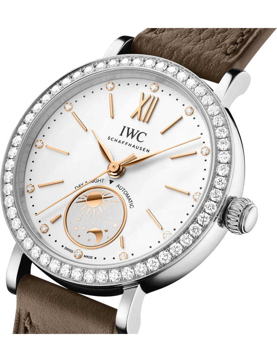 Side view of IWC Portofino Automatic Day & Night 34 wristwatch with stainless steel case, silver-plated dial, and taupe calfskin strap.