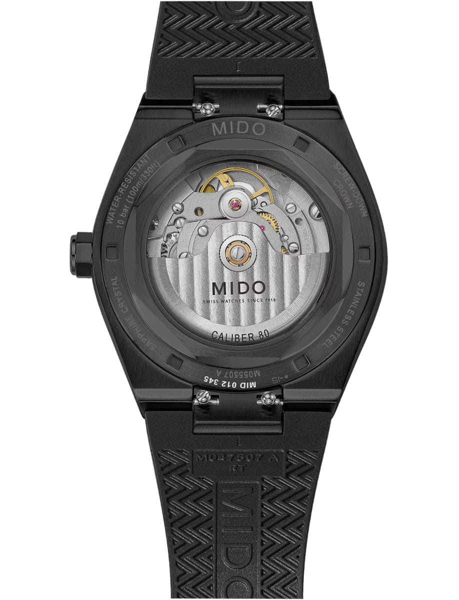 Back view of Mido wristwatch with stainless steel case with black PVD coating, black dial, and black rubber strap.