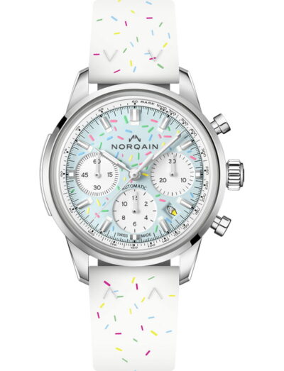 Norqain Sprinkles Blue Raspberry wristwatch with stainless steel case, light blue dial, and white rubber strap.