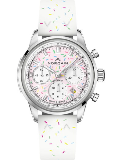 Norqain Strawberry wristwatch with stainless steel case, light pink dial, and blue rubber strap.