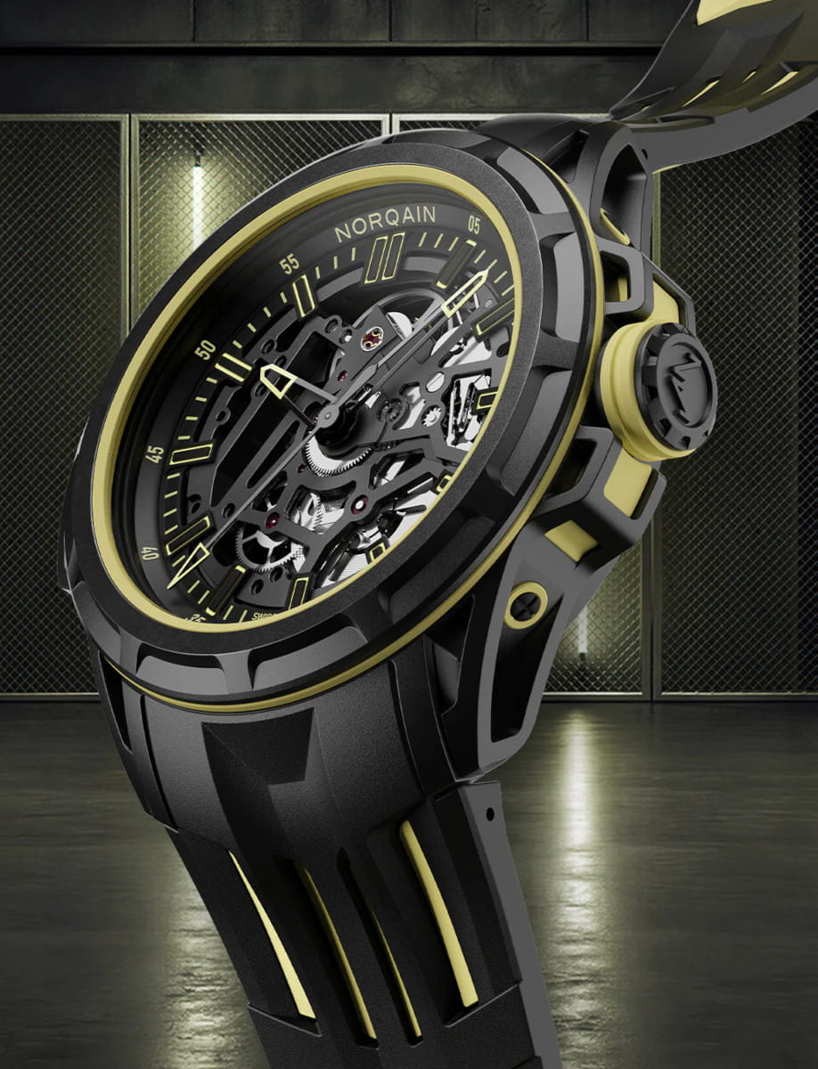 Side view of Norqain Wild ONE Skeleton X-Lite wristwatch with Black NORTEQ case, black dial with yellow printings, double layered black and yellow rubber strap.