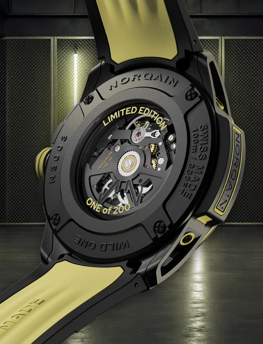 Back view of Norqain Wild ONE Skeleton X-Lite wristwatch with Black NORTEQ case, black dial with yellow printings, double layered black and yellow rubber strap.