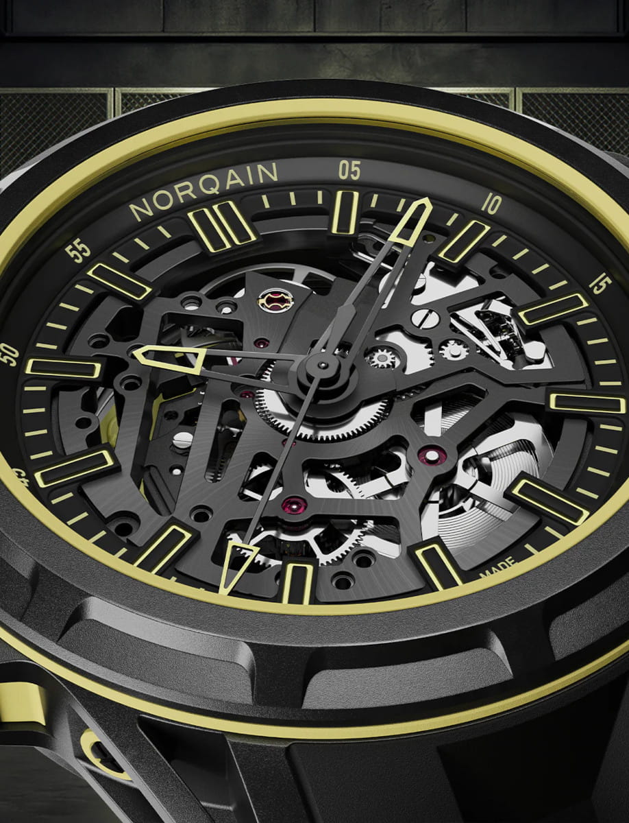 Close view of Norqain Wild ONE Skeleton X-Lite wristwatch with Black NORTEQ case, black dial with yellow printings, double layered black and yellow rubber strap.