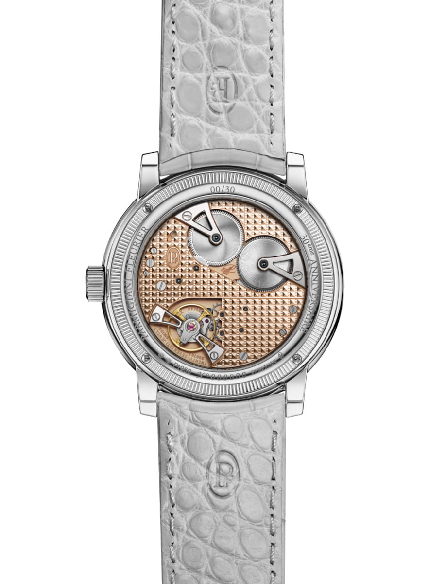 Back view of Parmigiani Fleurier Toric Petite Seconde wristwatch with 950 Platinum case, open case back, and alligator leather strap.