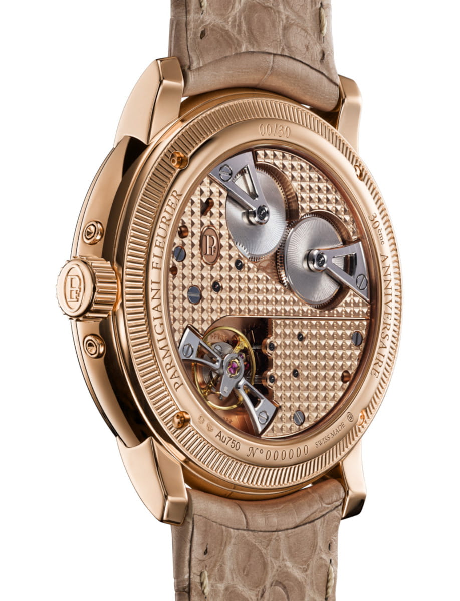 Back view of Parmigiani Fleurier Toric Quantieme Perpetuel wristwatch with 18k rose gold case, sapphire case back, and alligator leather strap.