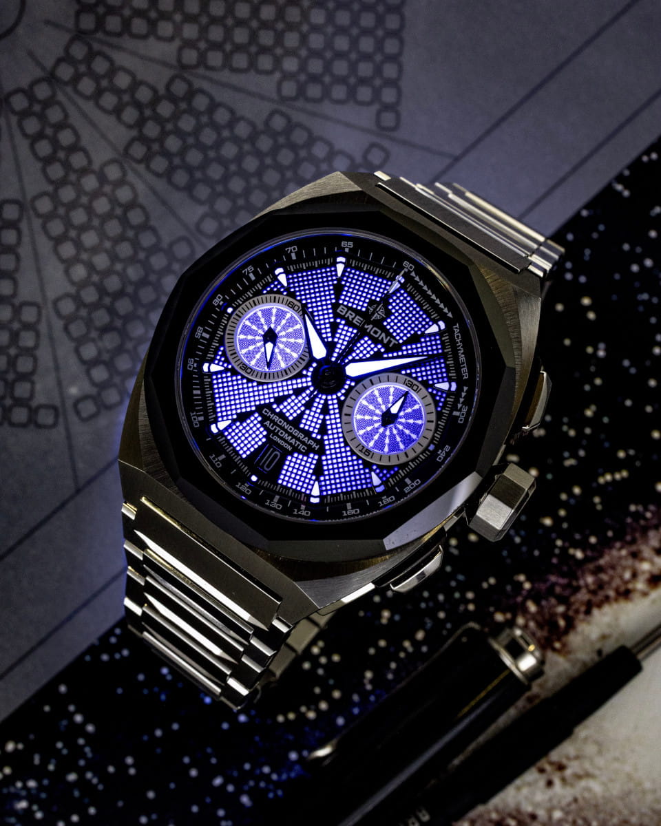 Hotlist image for night view of Bremont wristwatch with stainless steel case and bracelet black dial