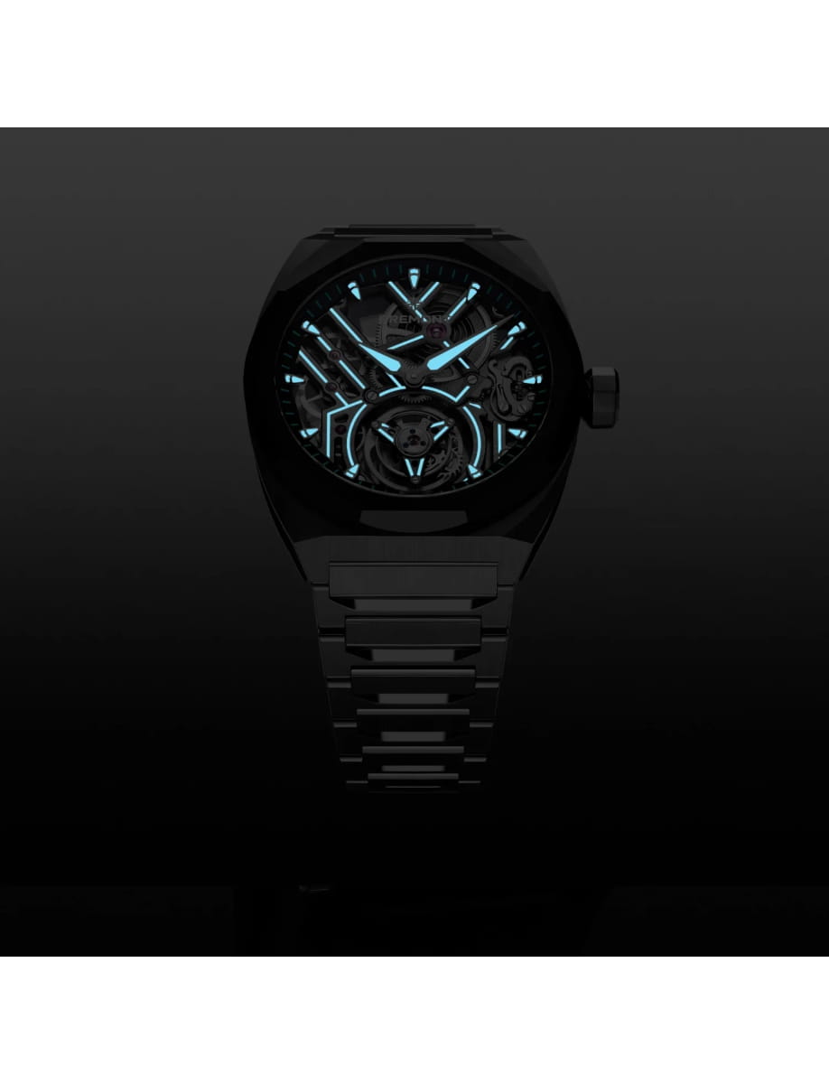 Night view of Bremont wristwatch with stainless steel case and bracelet and skeletonised dial