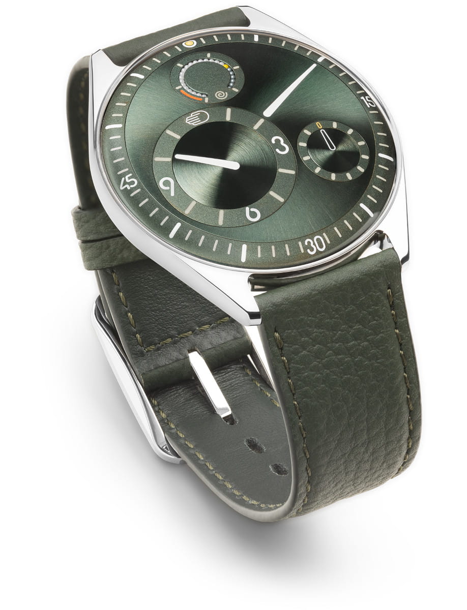 Front side view of Ressence wristwatch with grade 5 titanium case, green dial, and green leather strap.