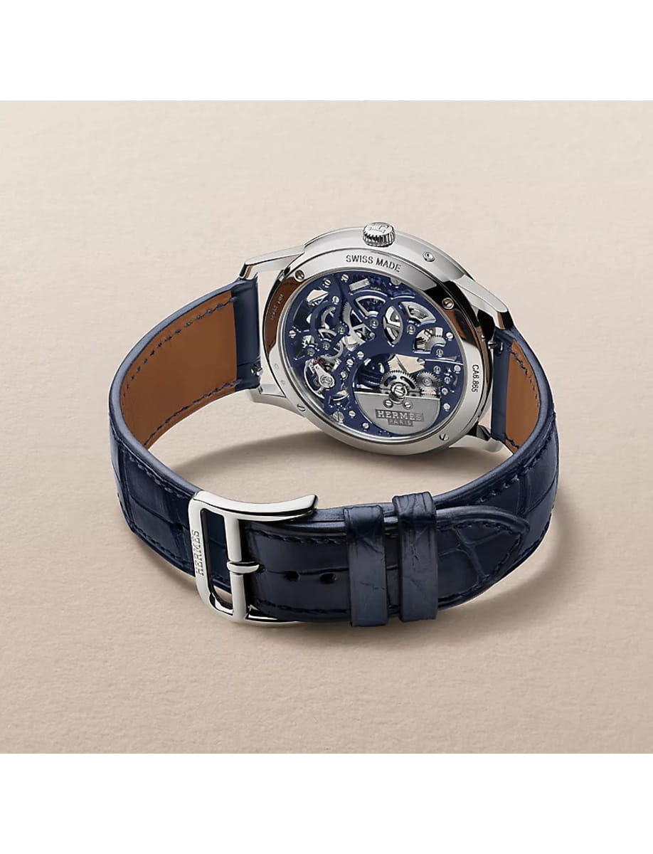 Back view of Hermes wristwatch with platinum case, blue skeleton dial and alligator leather strap