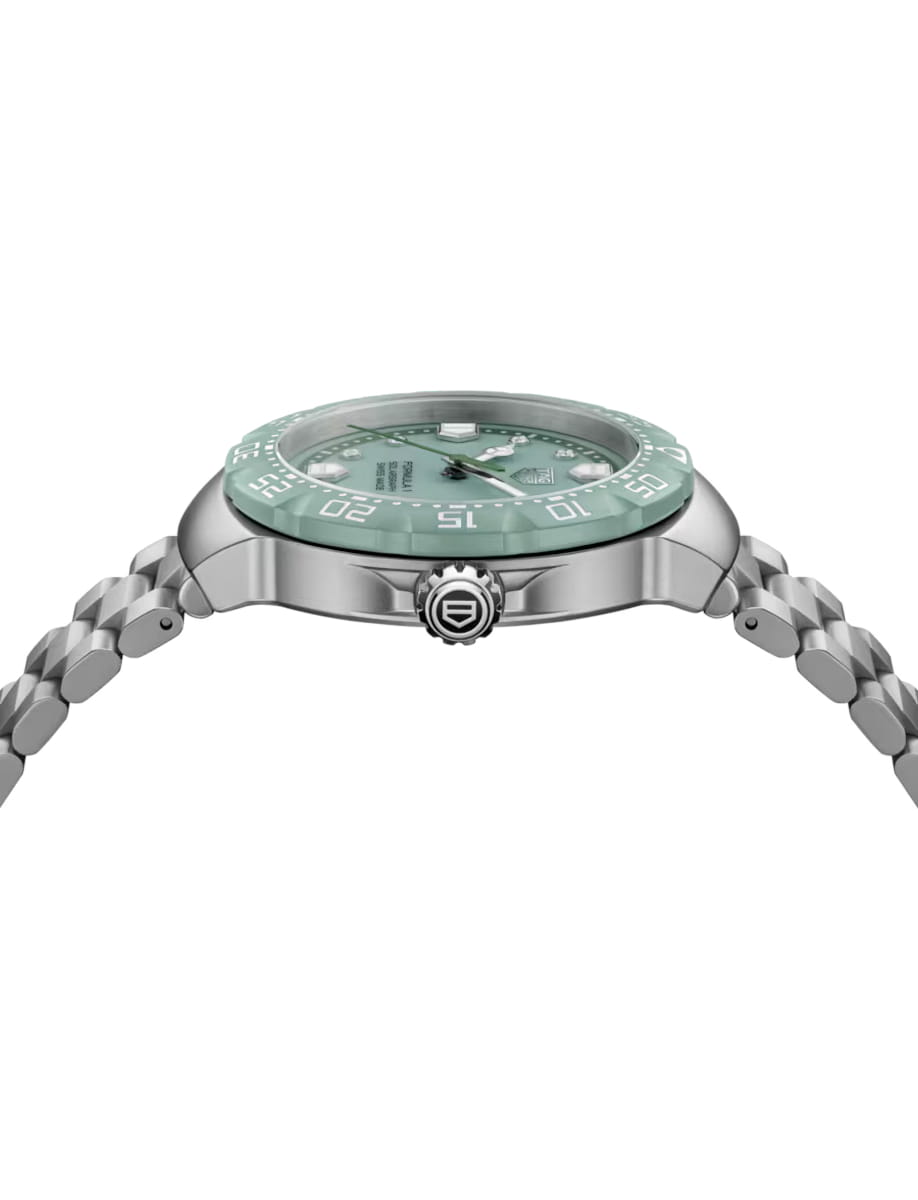 Side view of TAG Heuer wristwatch with stainless steel case and bracelet and opalin green dial