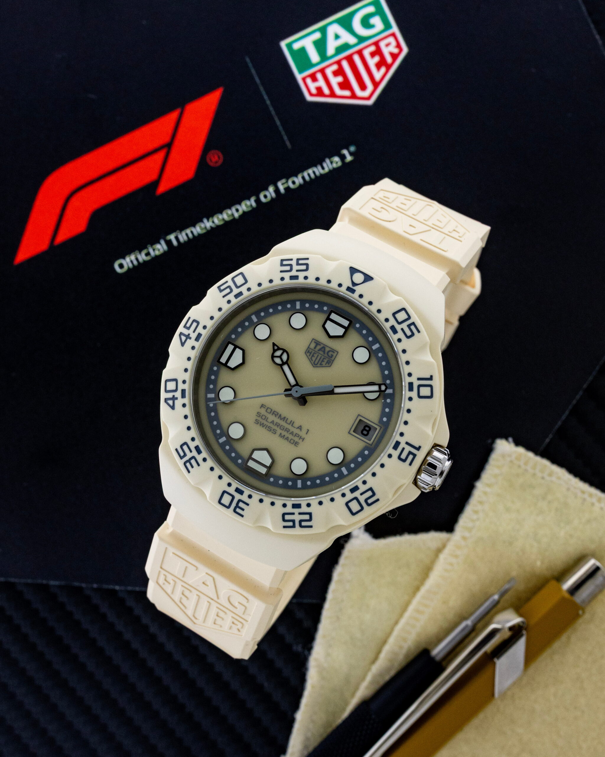 Hotlist image for TAG Heuer Formula 1 Solargraph wristwatch with TH-Polylight case, beige opaline dial, and beige rubber strap.