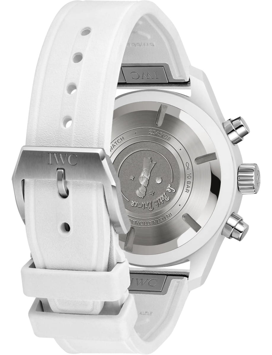 Back view of IWC Pilot's Watch Chronograph 41 Le Petit Prince wristwatch with ceramic case, blue dial, and white rubber strap.