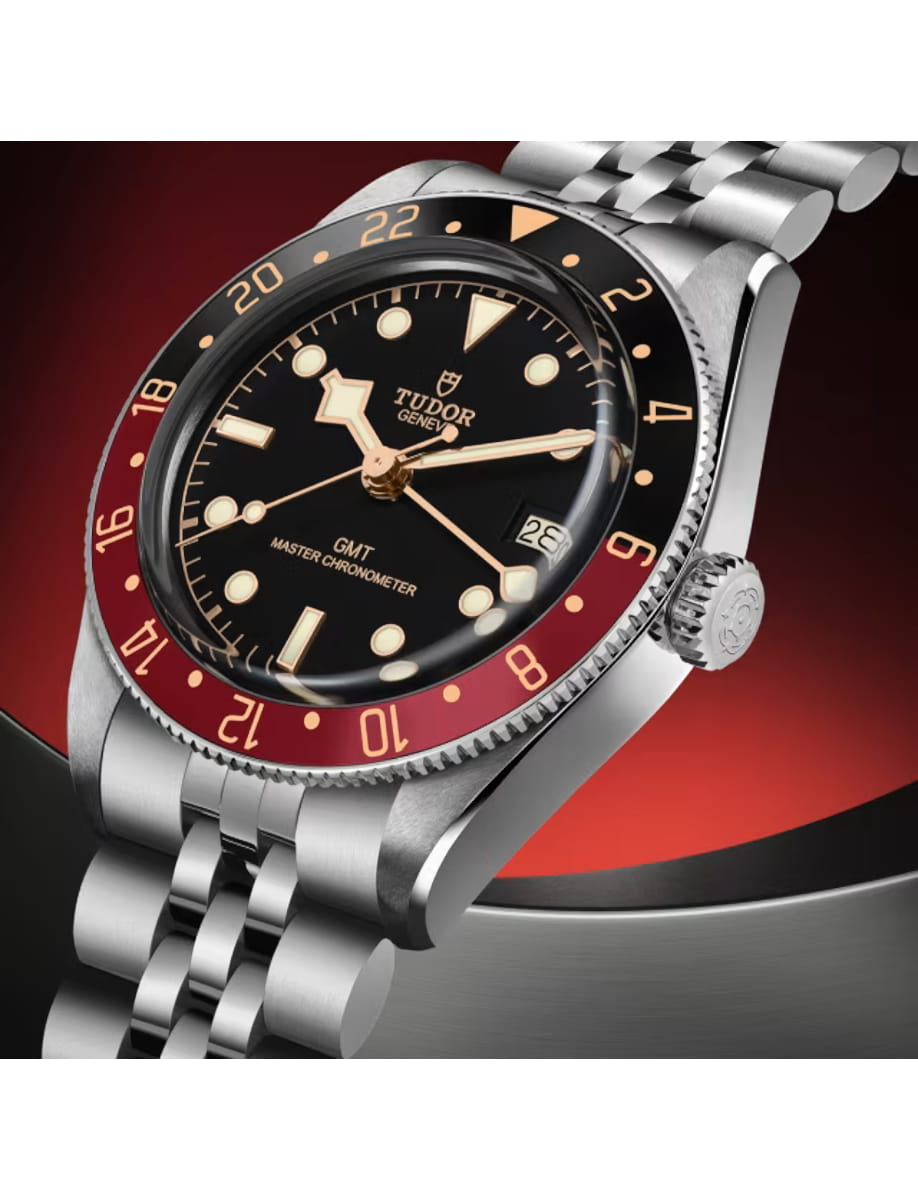 Side view of Tudor wristwatch with stainless steel case and bracelet and black dial