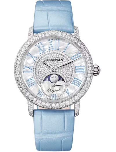 Blancpain Ladybird Colors Phases de Lune wristwatch with white gold case, white mother-of-pearl dial set with diamonds, and blue leather strap.