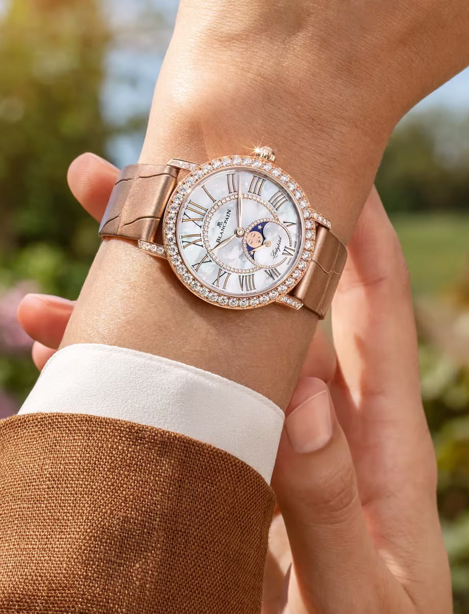Lifestyle image of Blancpain Ladybird Colors Phases de Lune wristwatch with red gold case, Mother-of-pearl set with diamonds dial, and alligator leather strap.