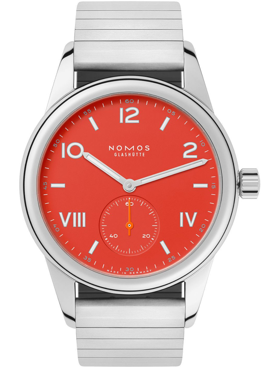Nomos wristwatch with stainless steel case, red dial, and sport bracelet.