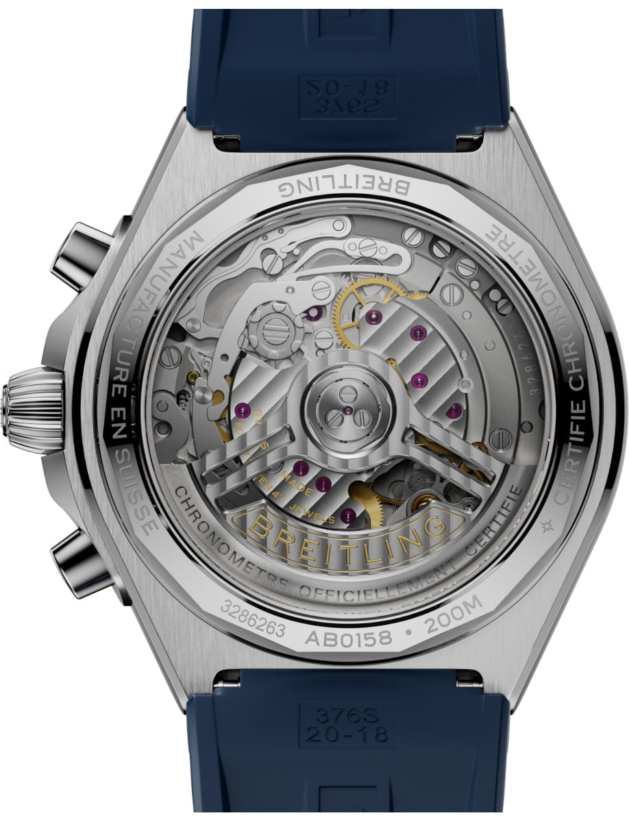 Back view of Breitling Chronomat B01 42 wristwatch with stainless steel case, blue and black panda dial, and blue rubber strap.