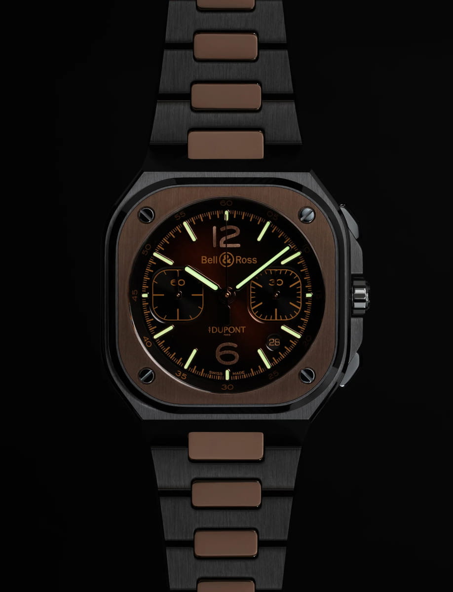 Night view of Bell&Ross wristwatch with stainless steel and 18k rose gold case and bracelet, and brown sunray dial.