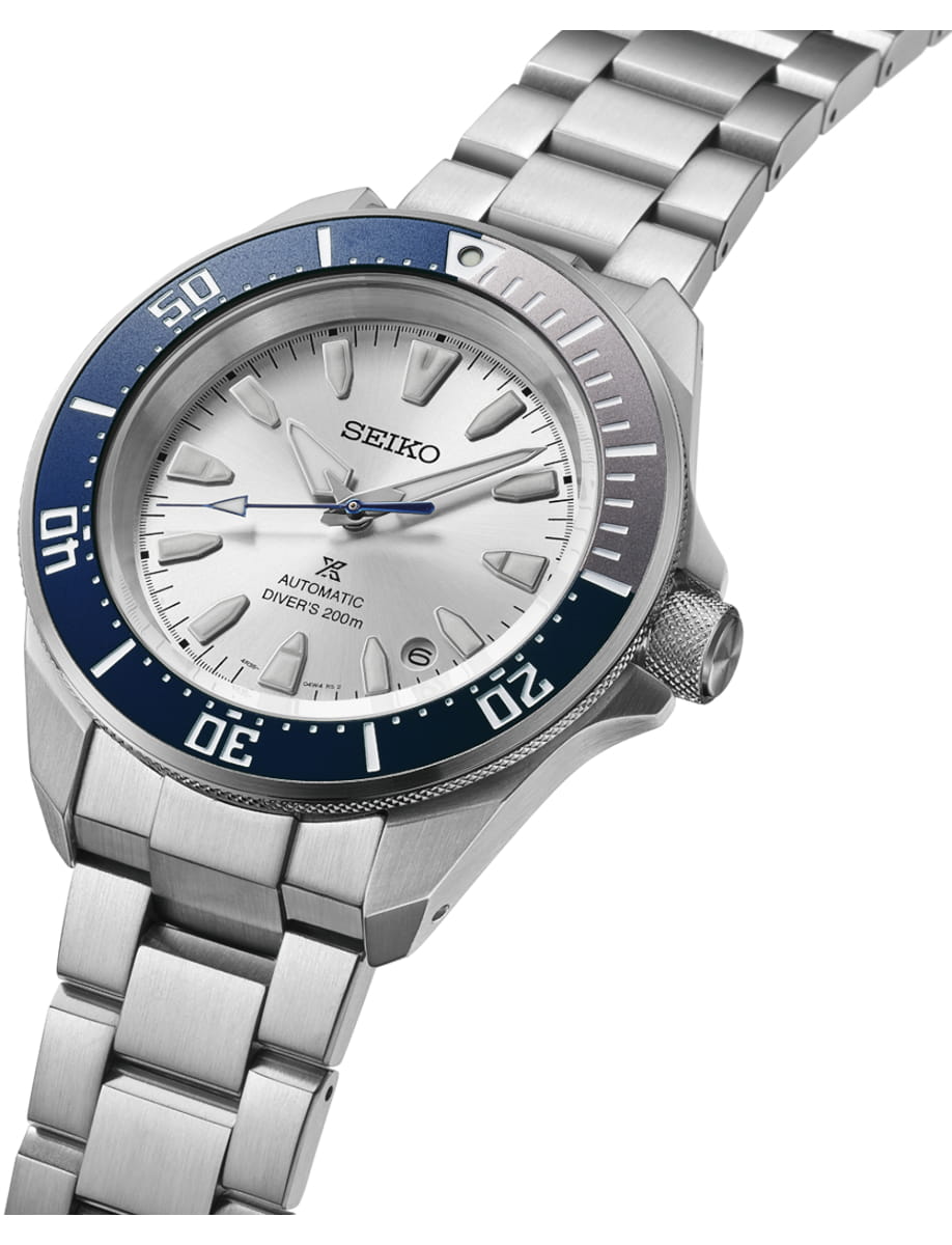Side view of Seiko wristwatch with stainless steel case and bracelet and silver white dial