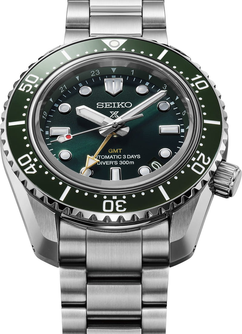 Front view of Seiko Prospex wristwatch with stainless steel case and bracelet, and green dial.