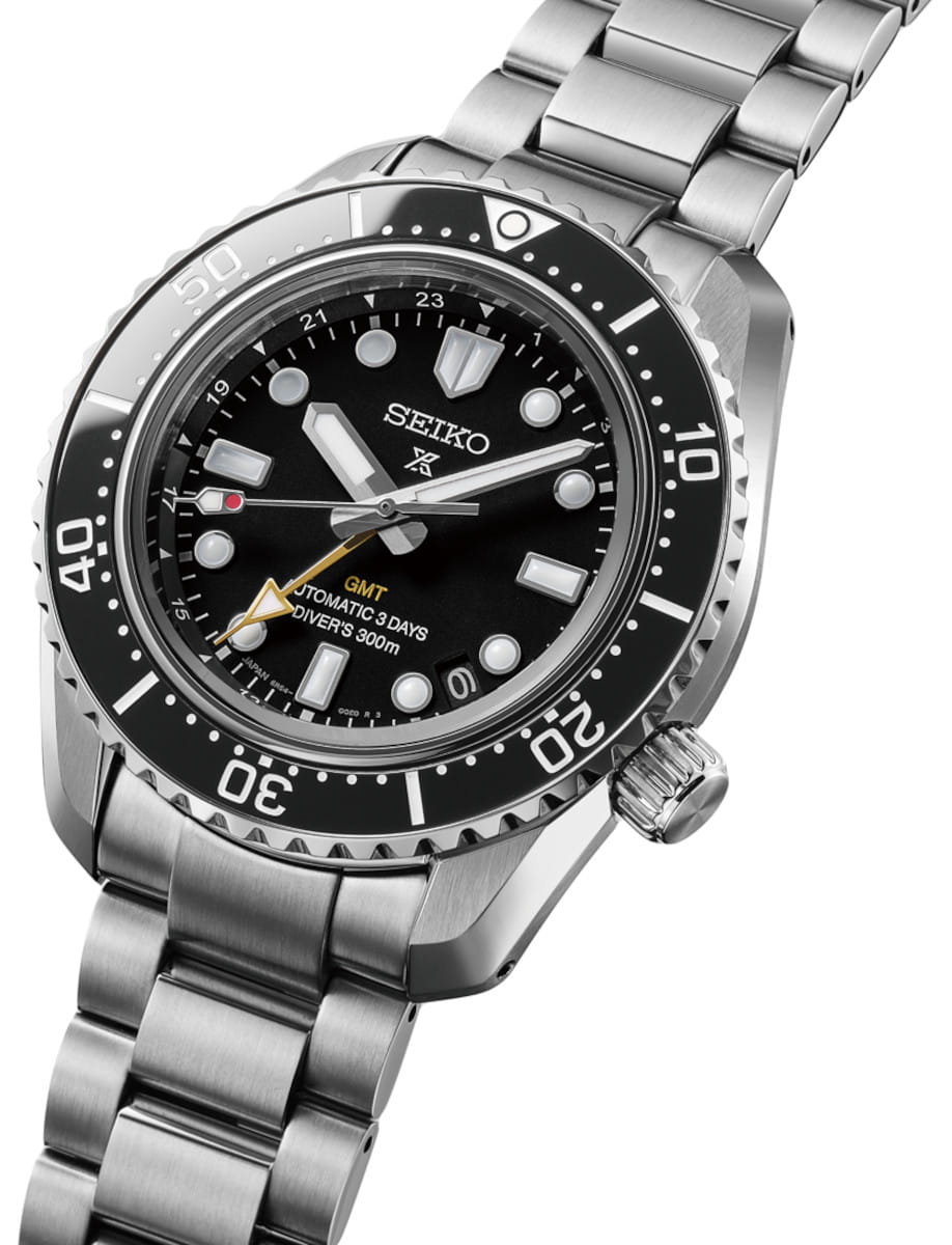 Side view of Seiko Prospex wristwatch with stainless steel case and bracelet, and black dial.