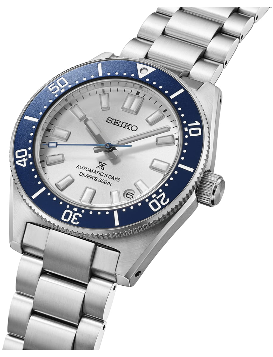 Side view of Seiko wristwatch with stainless steel case and bracelet and silver white dial